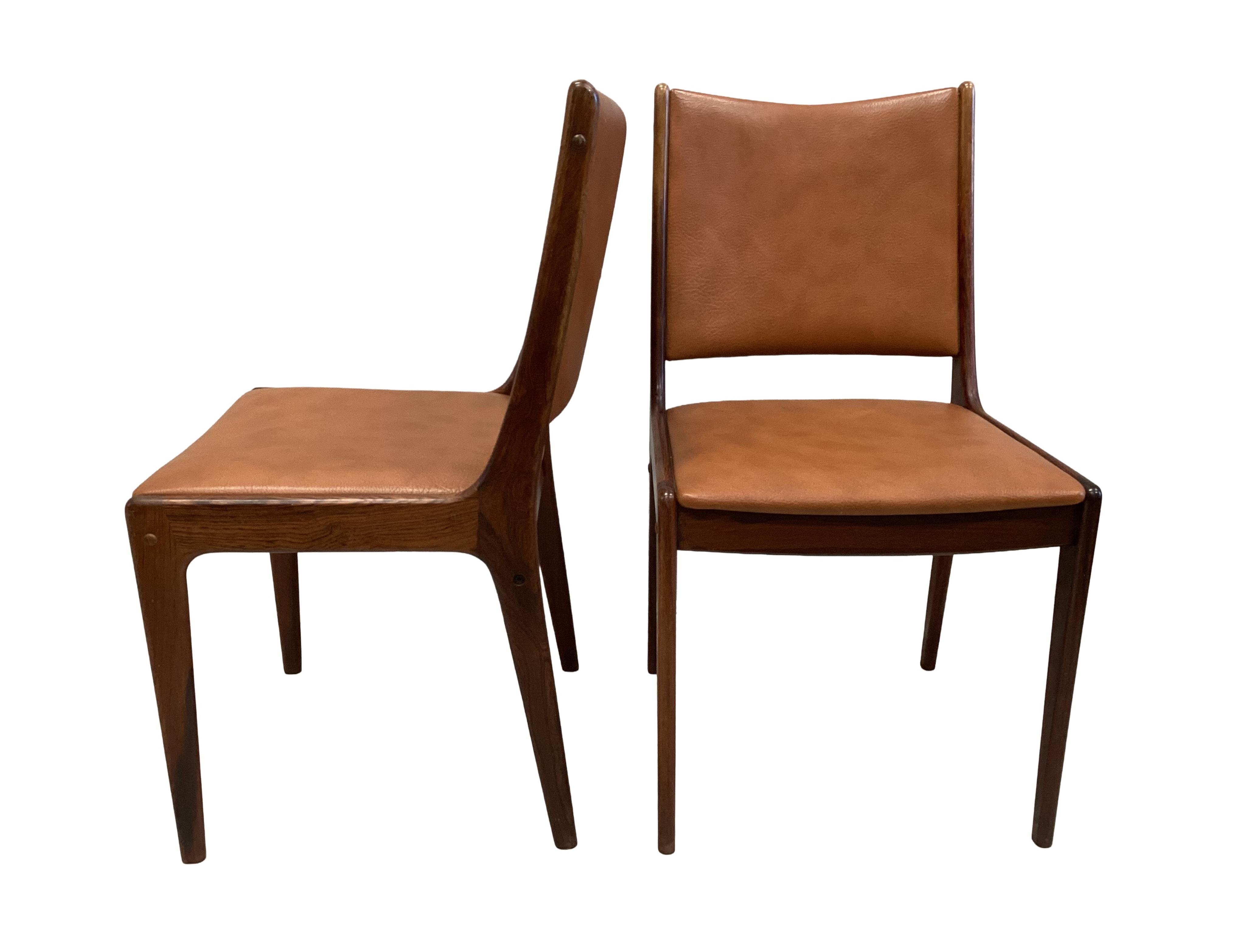 Johannes Andersen for Uldum Mobelfabrik, a set of six teak and tan leather dining chairs, width 42cm, height 84cm